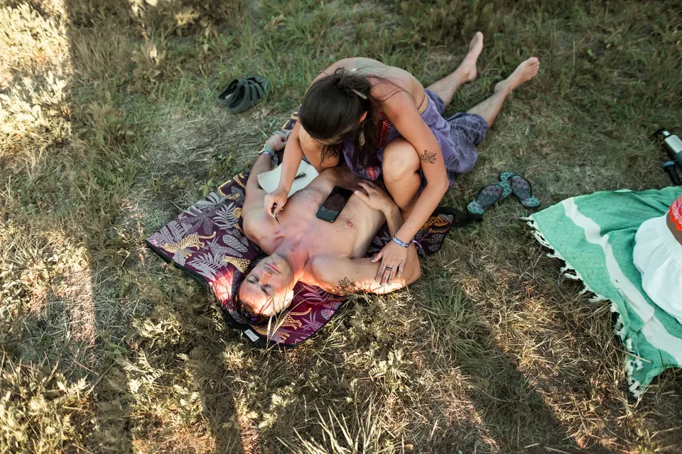 A bodywork session on a blanket in the meadow