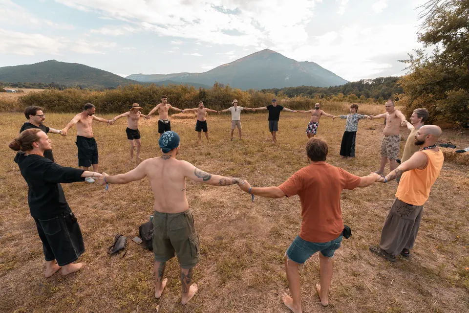A circle holding hands below Rtanj